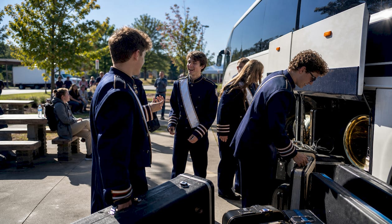 Students loading instruments for band trip