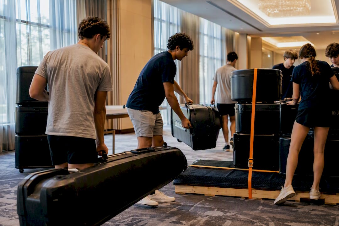 students organizing instruments for freight shipment